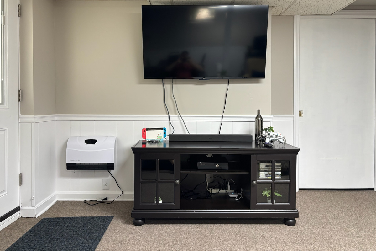 60" Game-room TV with an Xbox 360 and Nintendo Switch.