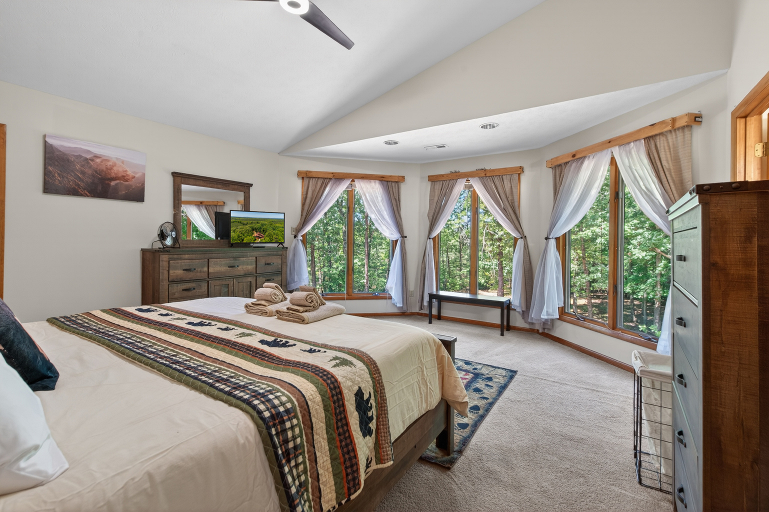 Spacious Bedroom 1 Retreat: Wake up to stunning forest views and unwind in style!