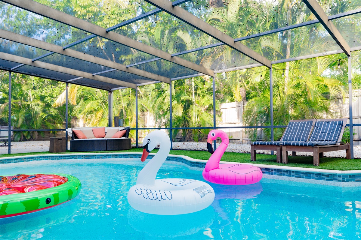 Covered and screened hot tub, ping pong, heated pool and patio.