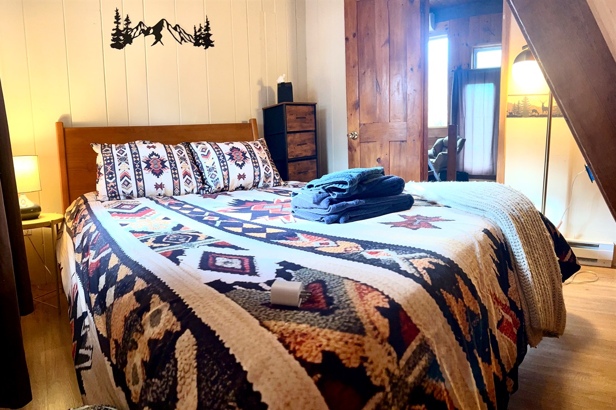 First floor bedroom with queen bed.