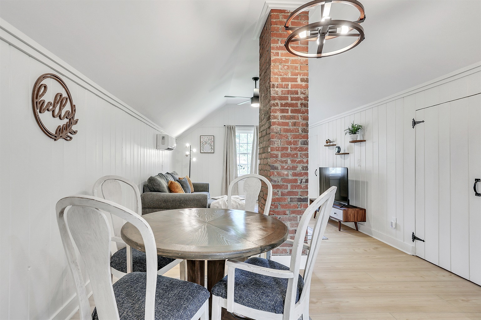 Enjoy meals surrounded by character—exposed brick details add a touch of historic charm to this intimate dining space.