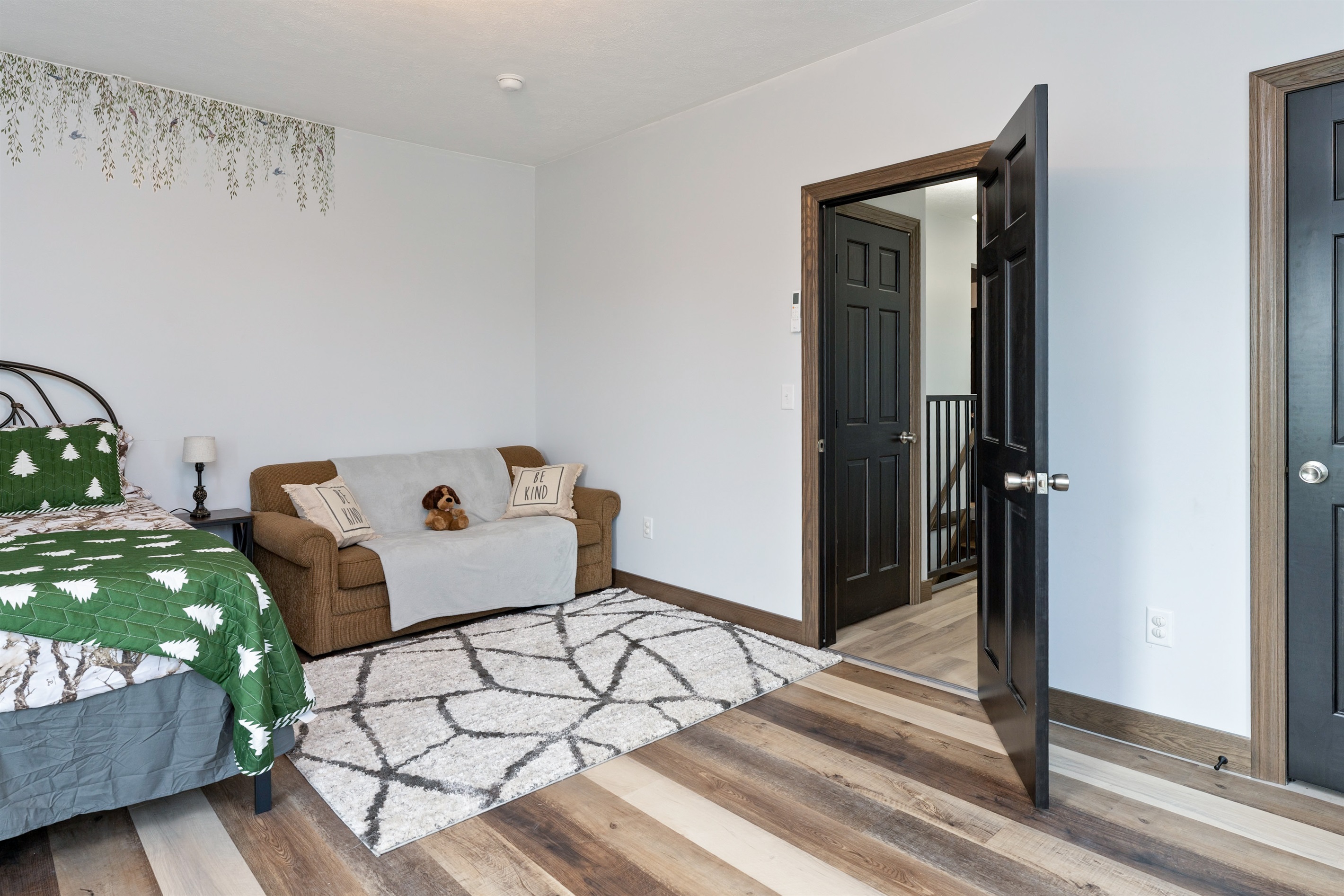 Inviting Queen bedroom with queen fold out sofa woodland-themed décor, and plenty of space to unwind. Bedroom #4