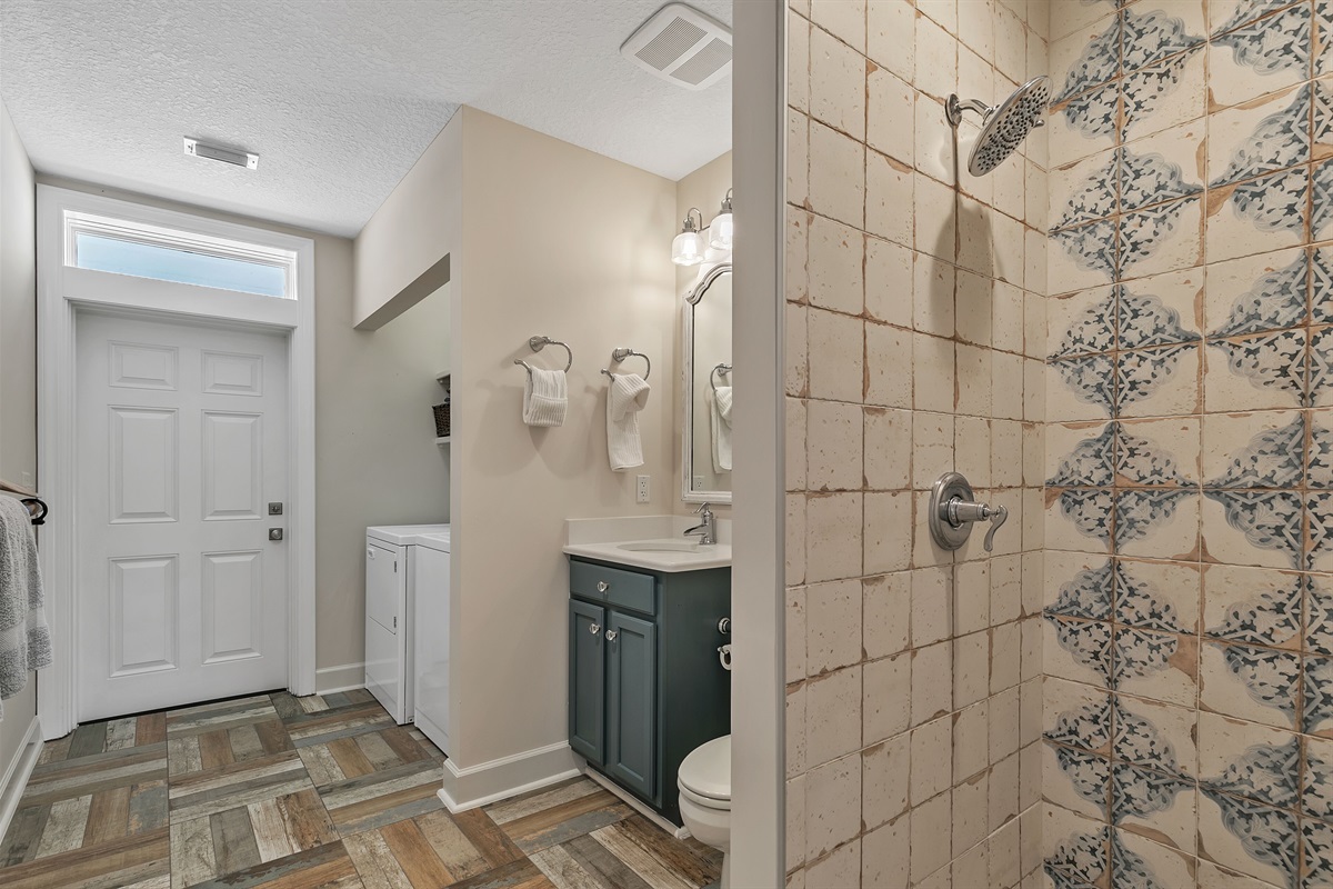 Hall bath with shower and full laundry and direct deck/beach access.