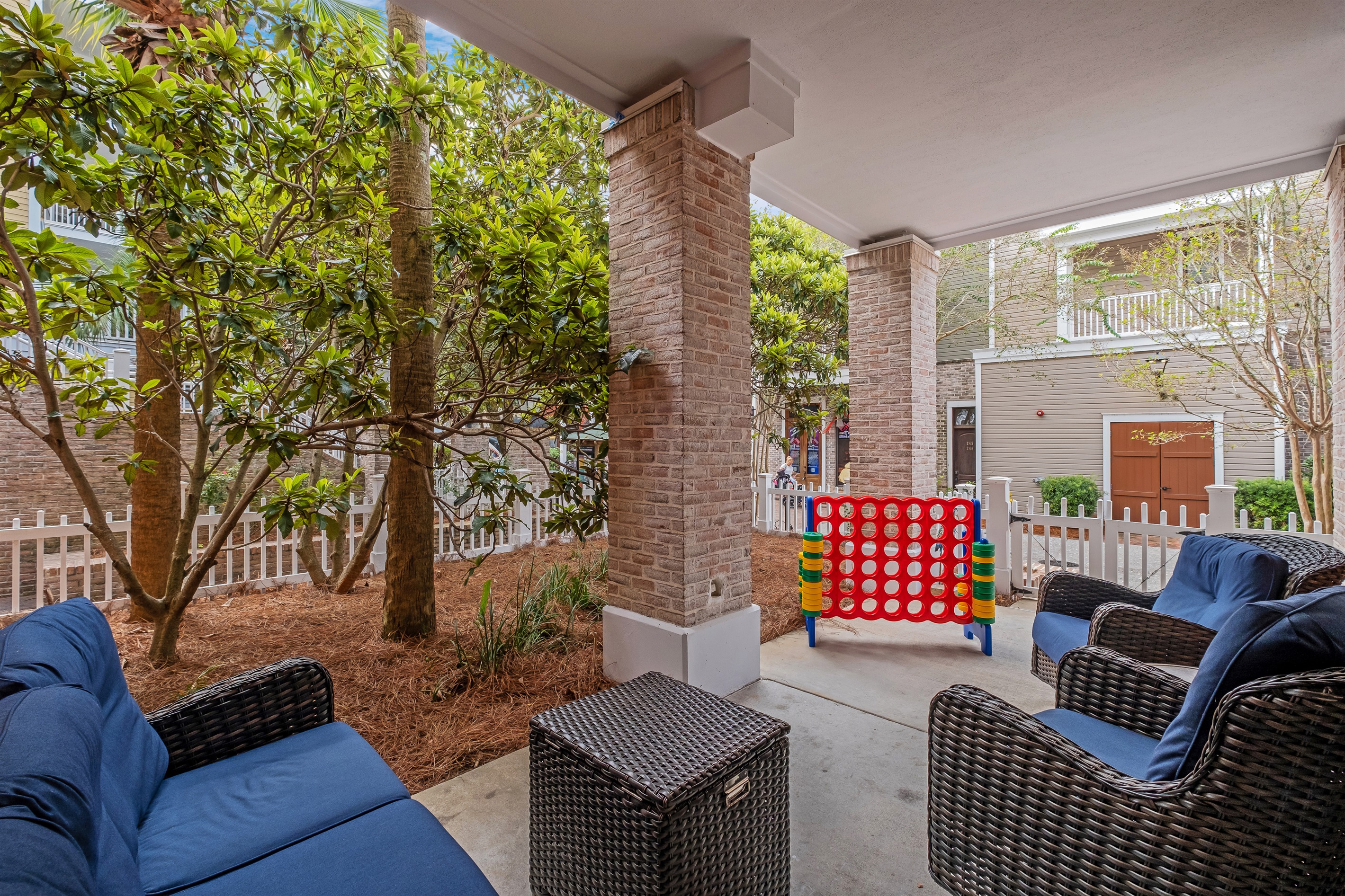 Perfect for both relaxation and play, this outdoor space features cozy seating and a fun Connect 4 game, ideal for kids and adults alike.