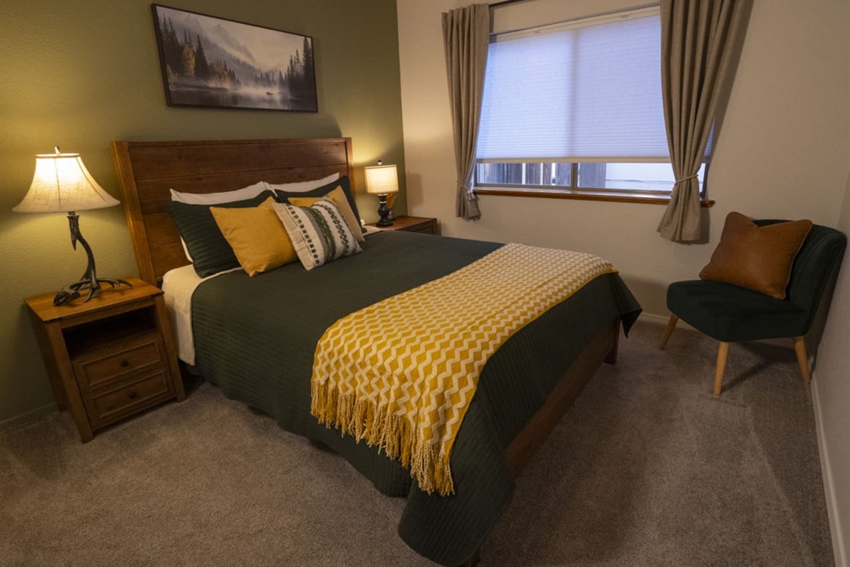 Bedroom features a queen bed, closet space, and a cozy setup for a good night’s sleep.