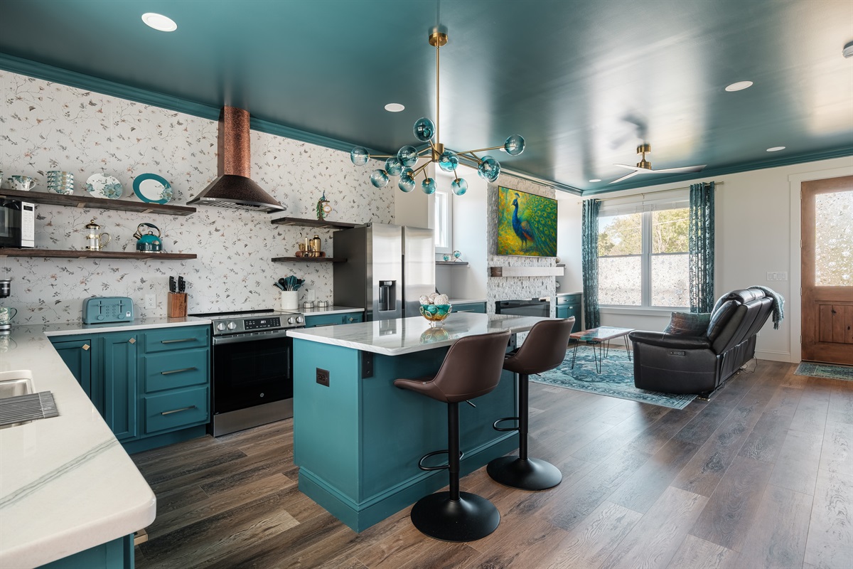 The open-concept layout connects the living room and kitchen, creating an inviting flow perfect for relaxing mornings or romantic evenings in.