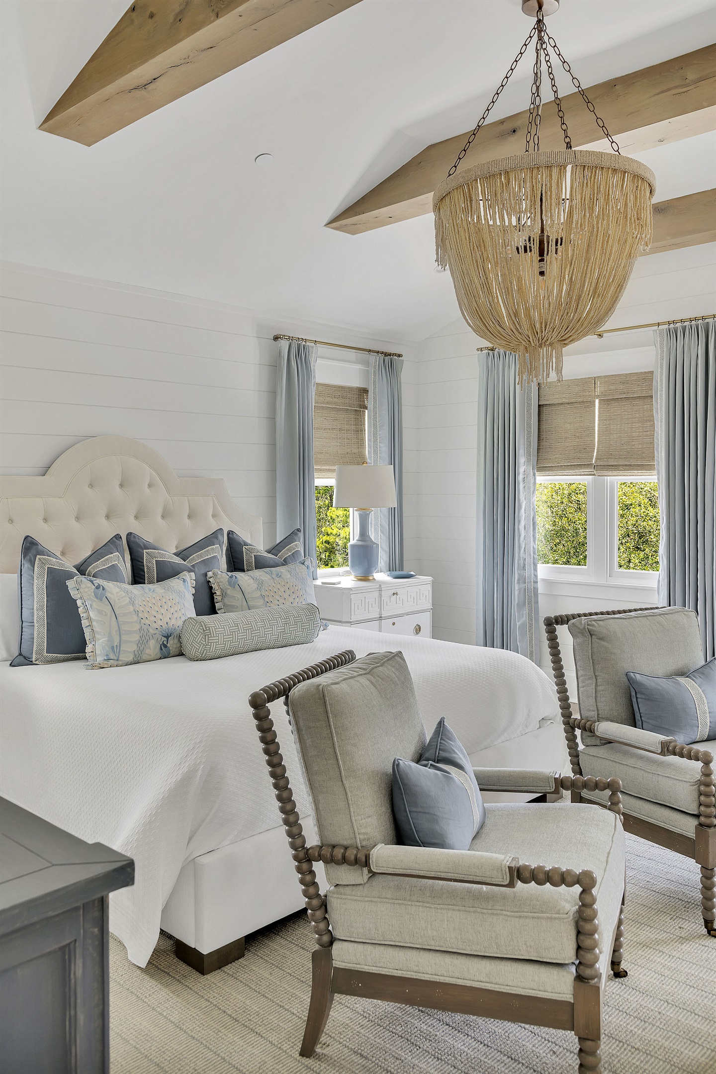 Two spindle armchairs are perfect for relaxing in front of the fireplace.