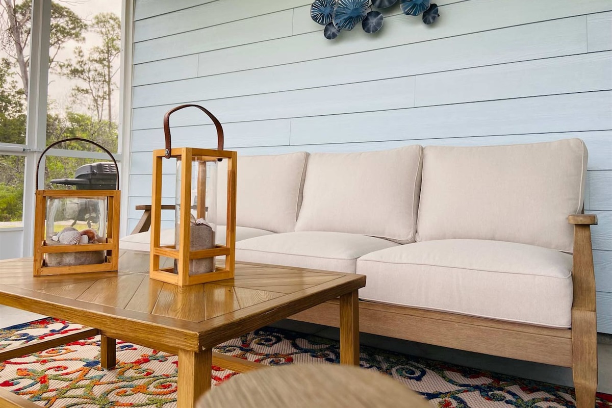 Plush cushions on the back porch make morning coffee comfortable and relaxing