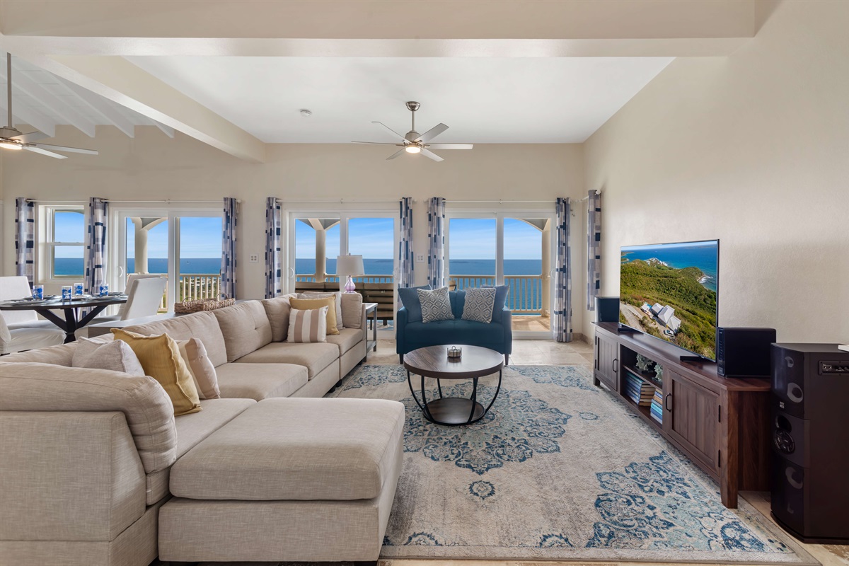 Unwind in the spacious living area with stunning ocean views all around.