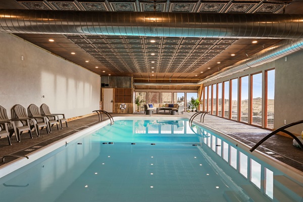 Enjoy a swim in the enormous indoor pool overlooking stunning mountain views