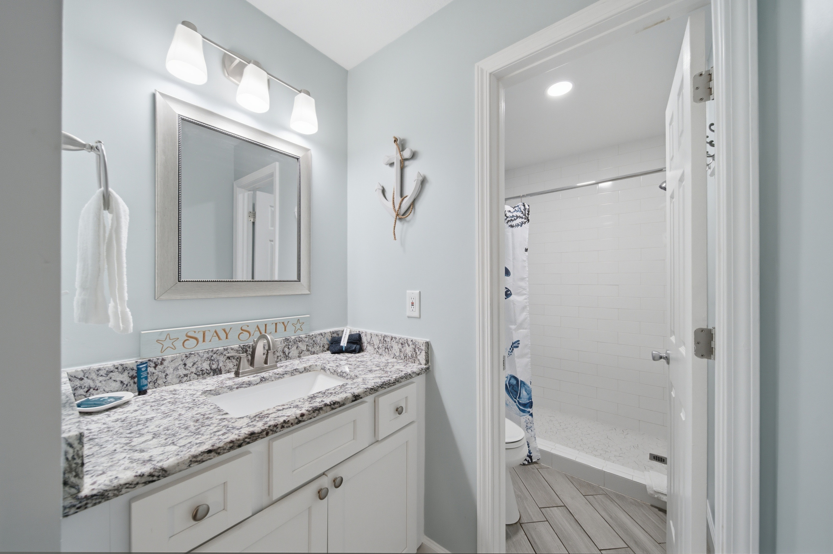 Ensuite bathroom with double vanity and granite counters