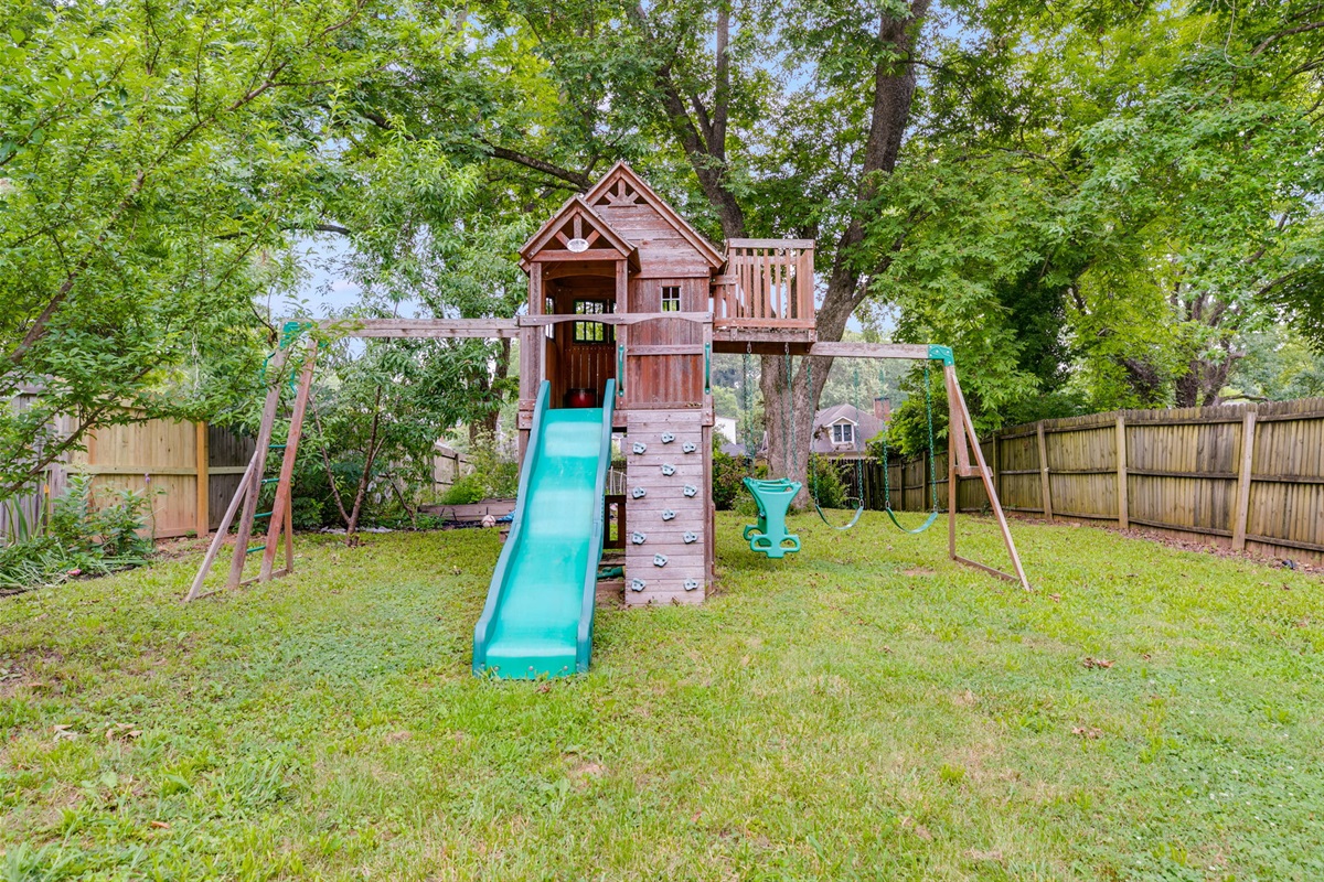 Your own private backyard park. Fenced for safety, filled with swings, slides, and a picnic table—perfect for family fun and relaxing afternoons.