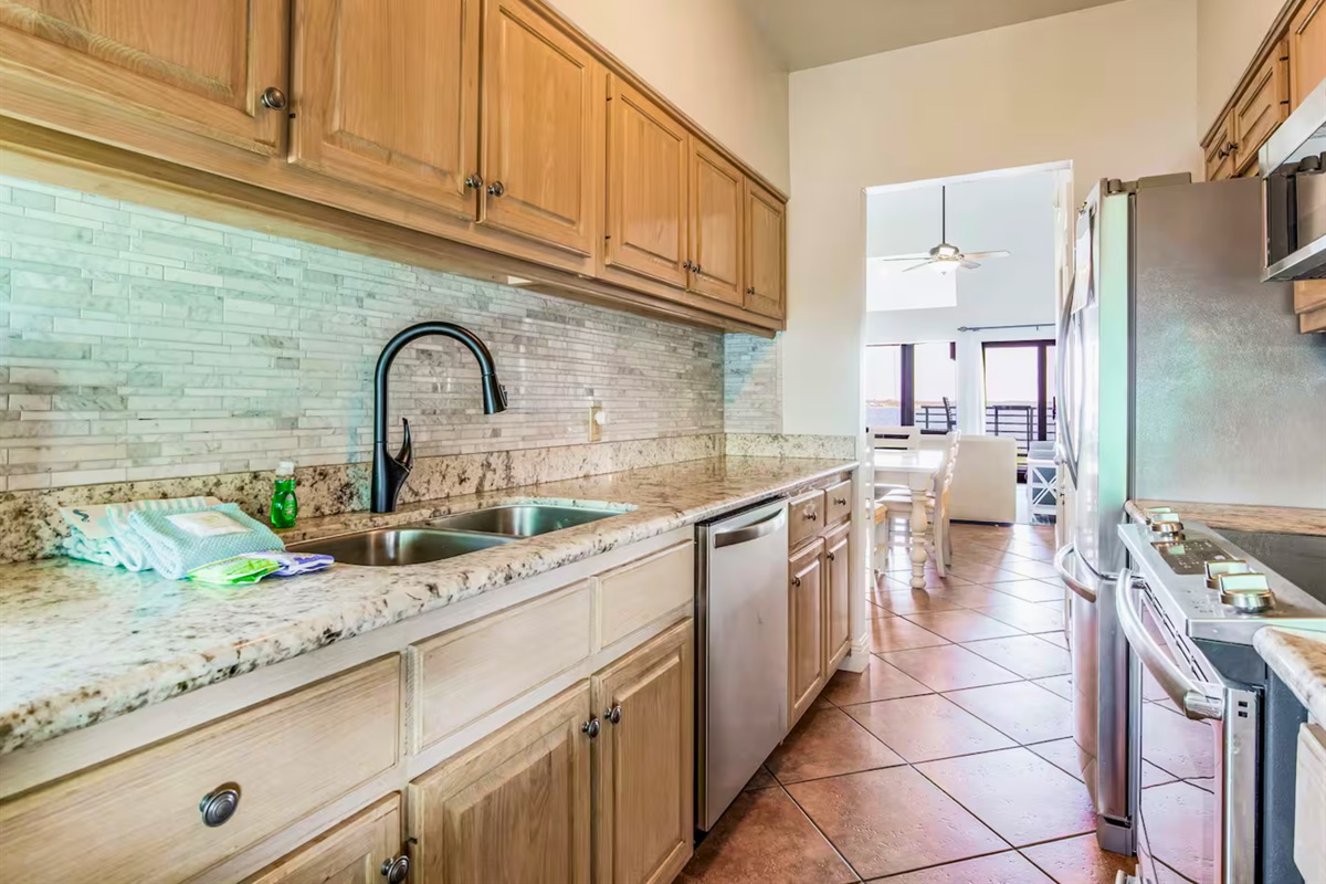 Bright and functional, the kitchen is stocked with everything you need for your stay.