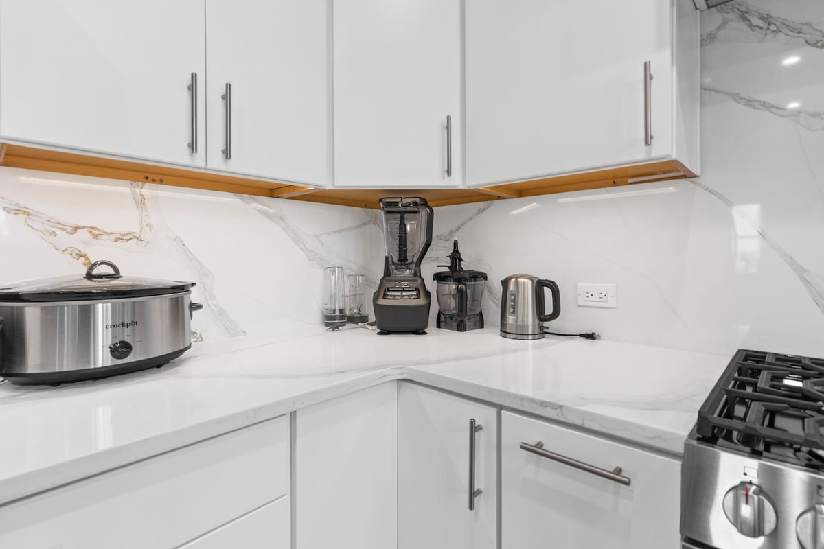 A chef's dream! Designed for large groups, this spacious kitchen offers generous prep space, premium appliances, and everything you need to cook and gather with ease.