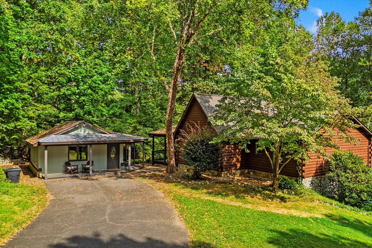 This spacious cabin retreat is perfect for any time of year with its expansive outdoor living areas and direct river access just steps away.