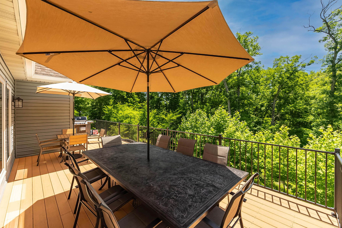 Enjoy morning coffee beneath the shade umbrella.