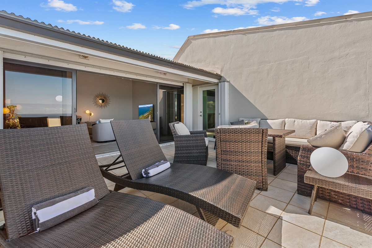 Enjoy the Caribbean sun from the balcony lounge chairs