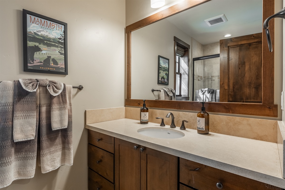 Interstellar | Each home includes a convenient main-level bathroom to serve the living spaces and nearby bunkroom, with a spacious vanity and plenty of room to get ready after a day on the mountain.
