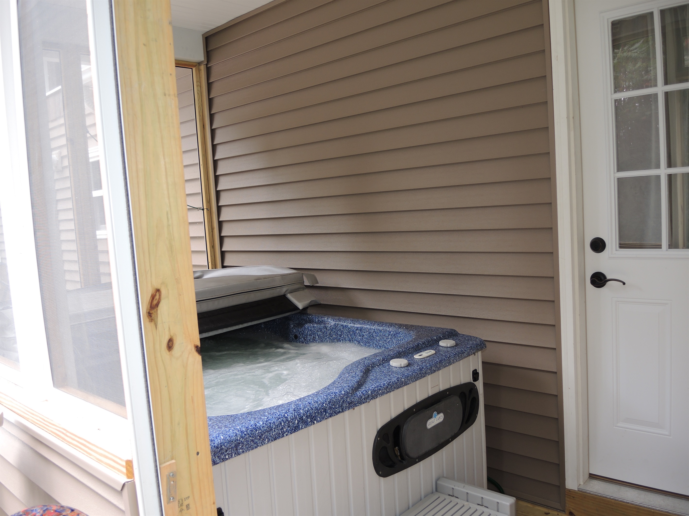 Hot tub on screened in porch