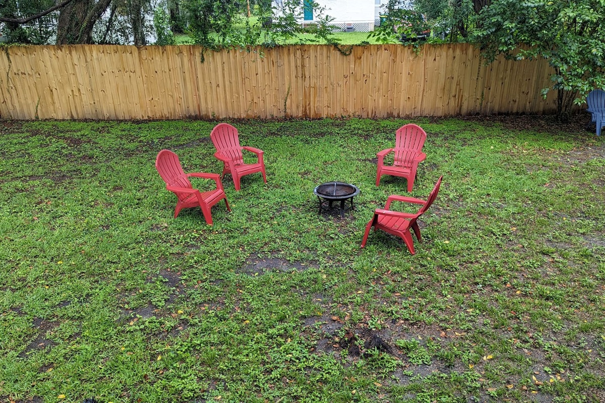 Gather with friends by the fire in the backyard