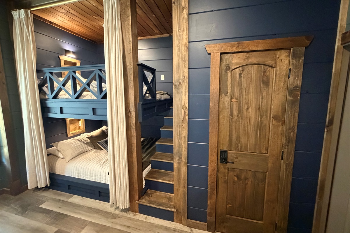 Luxury built-in Queen bunks, with curtains for privacy, built in shelf and outlet for your phone