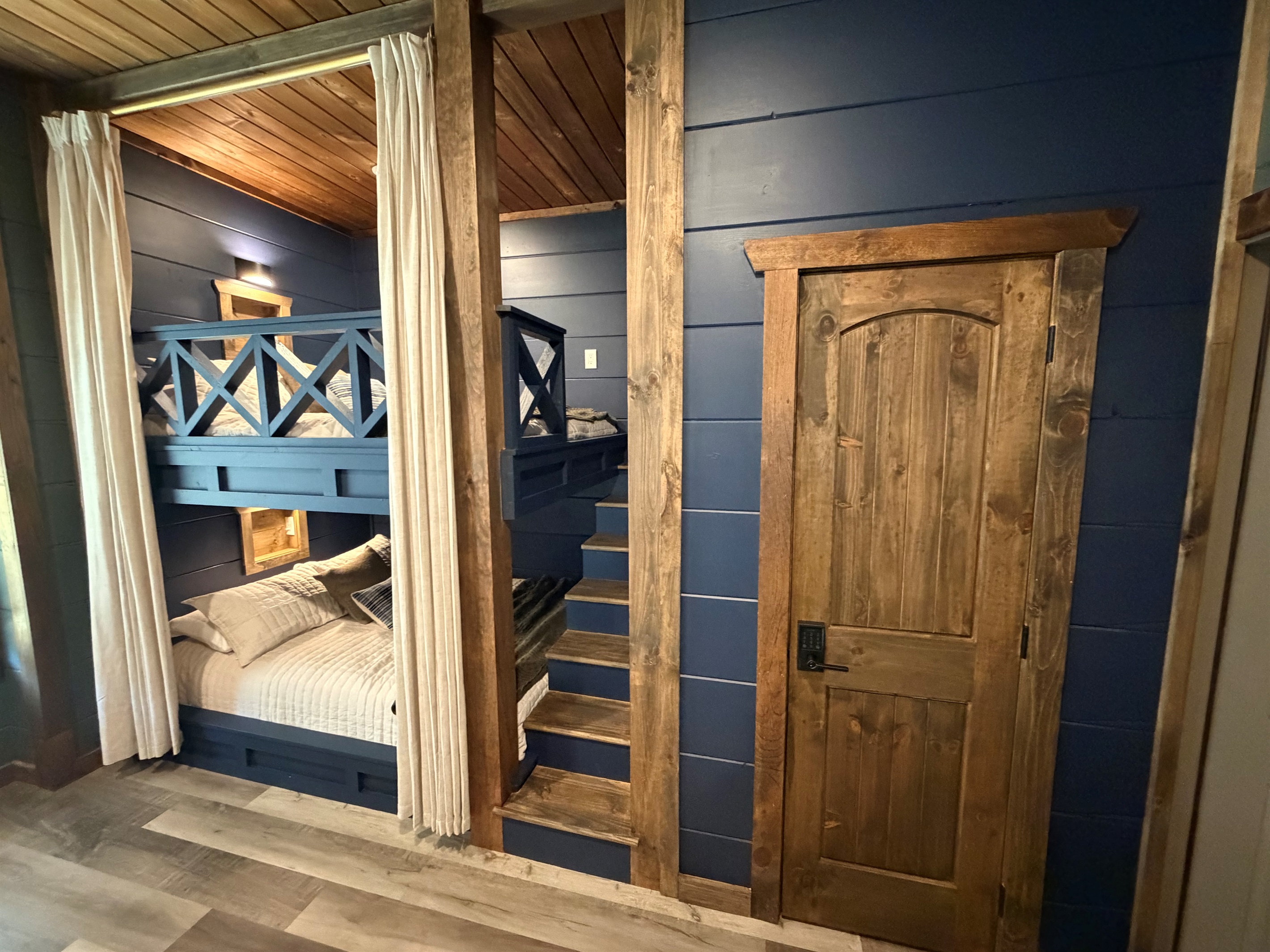 Luxury built-in Queen bunks, with curtains for privacy, built in shelf and outlet for your phone