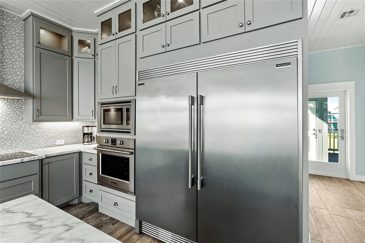 Crystal Paradise: A chef’s dream kitchen with luxurious appliances and breathtaking ocean views.