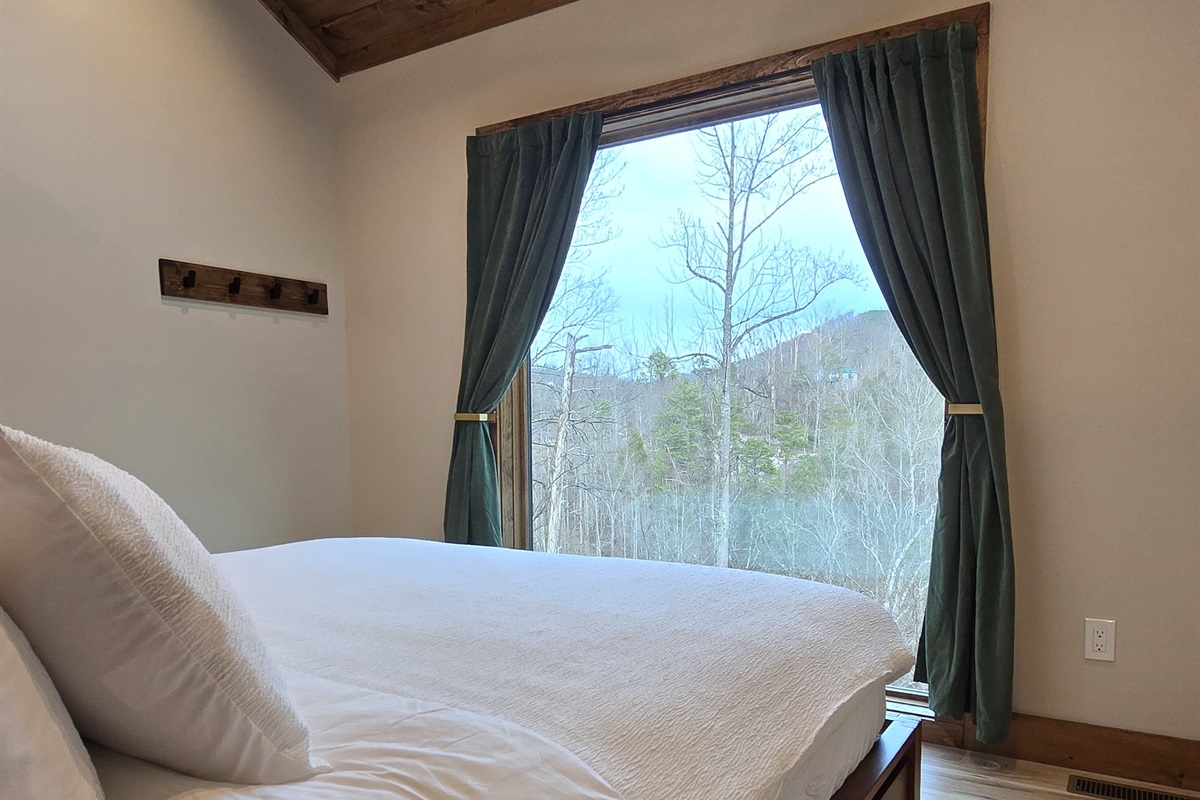 The bedroom features a giant 7' window and skylight window.