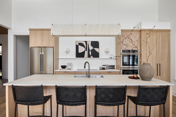 The heart of the home—this elegant kitchen combines sleek design with practicality, featuring a large island, premium appliances, and plenty of prep space.