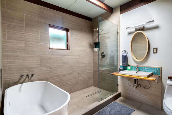 Completely renovated bathroom with deep tub and rain shower. 
