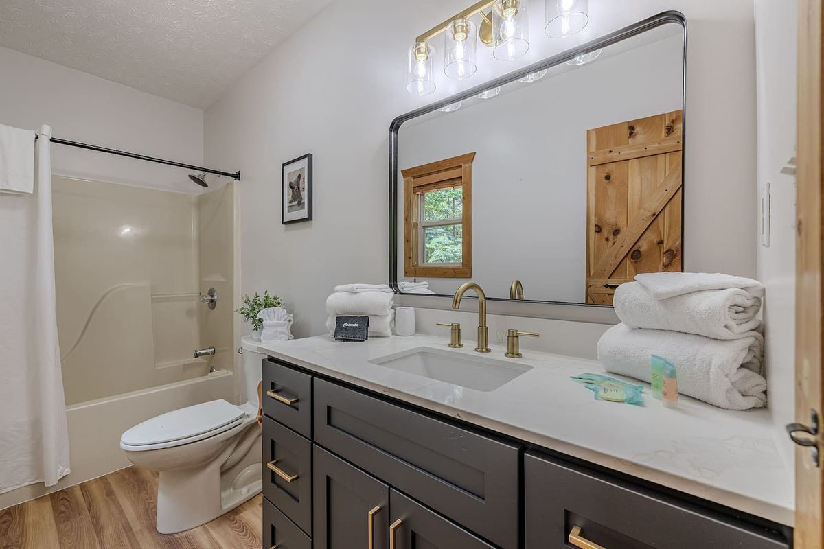 Enjoy a spacious bathroom with plenty of counter space and a full-size shower/tub.