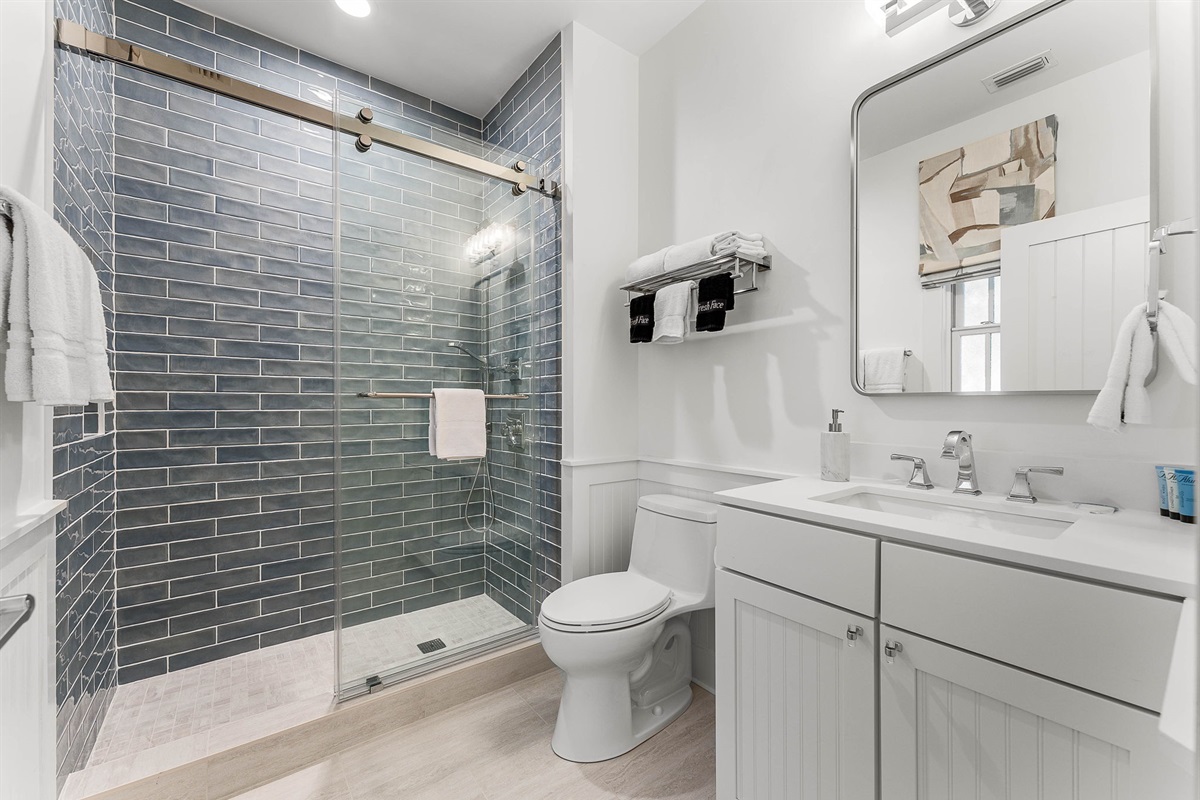 Attached King bathroom with enclosed glass shower