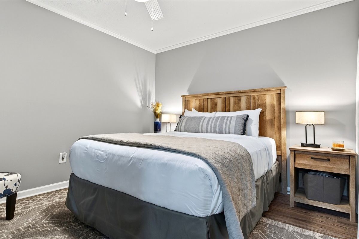 Lower level bedroom with a queen size bed