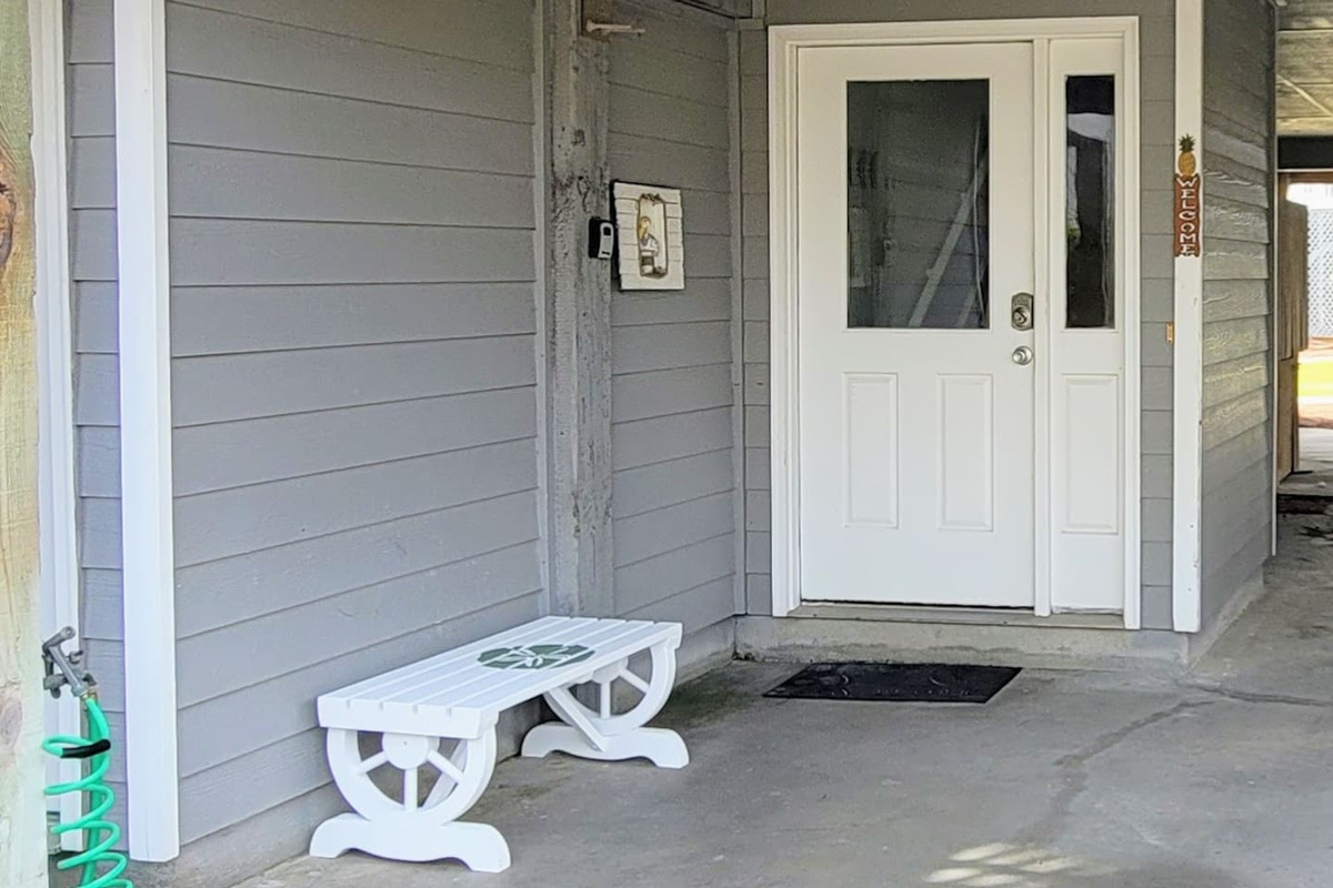 Rinse off before you even reach the door &mdash; the hose out front means sandy paws and salty toes stay where they belong.