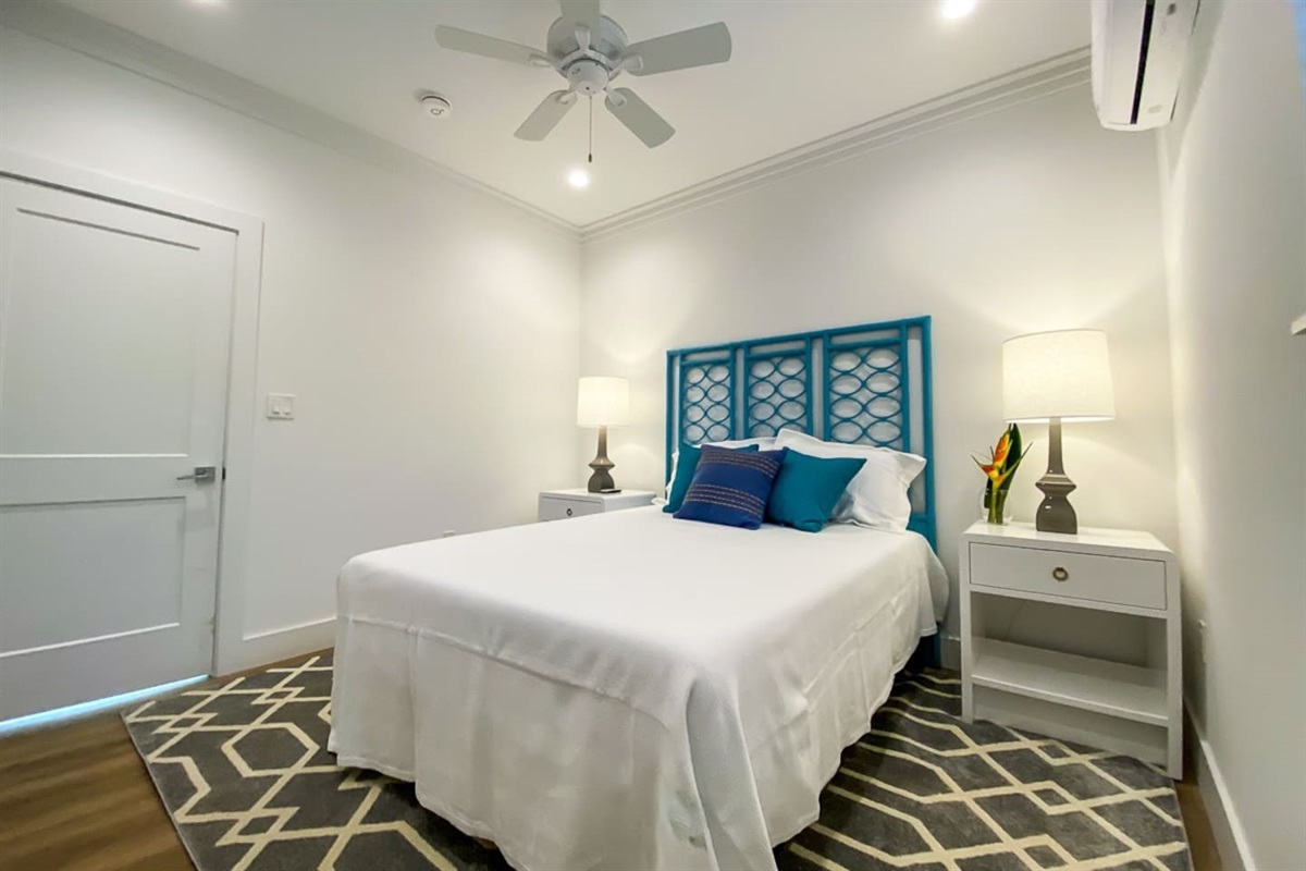 Spacious Bedroom 2 with modern furnishings.