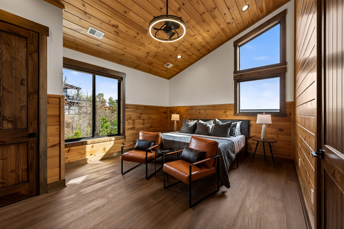 Private King Suite Retreat- on its own private wing of the home, this spacious king master bedroom features vaulted ceilings & beautiful Smoky Mountain views. Relax in the en-suite spa bathroom with a XL soaking tub, with the home gym just steps away.