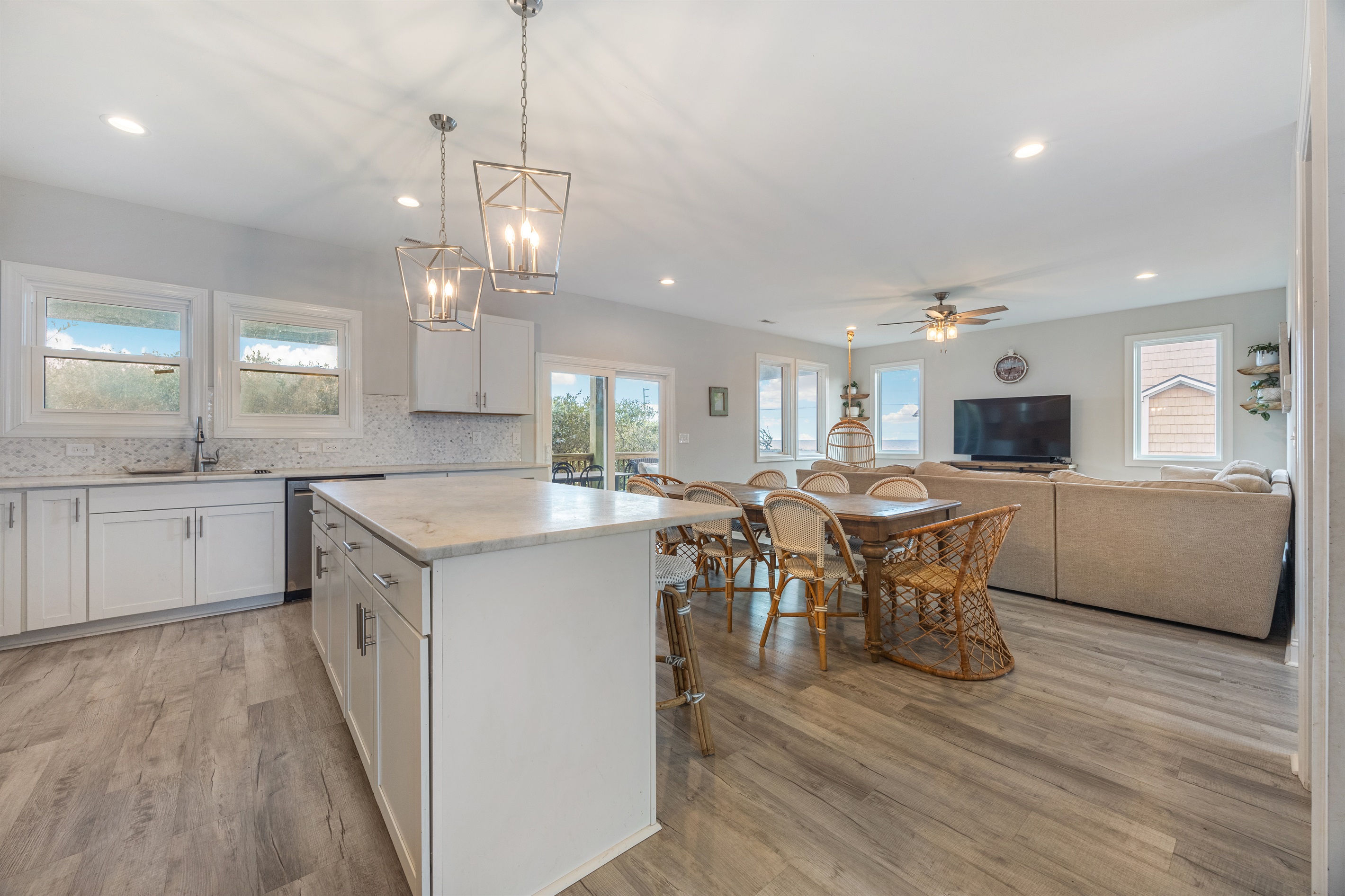 Seamless flow between living, dining, and kitchen areas.