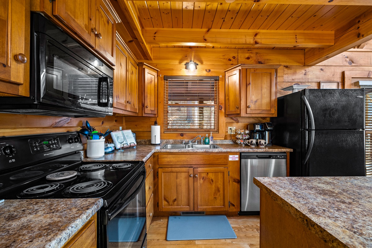 A fully equipped kitchen featuring modern appliances and all the essentials needed to prepare anything from quick bites to full family meals.