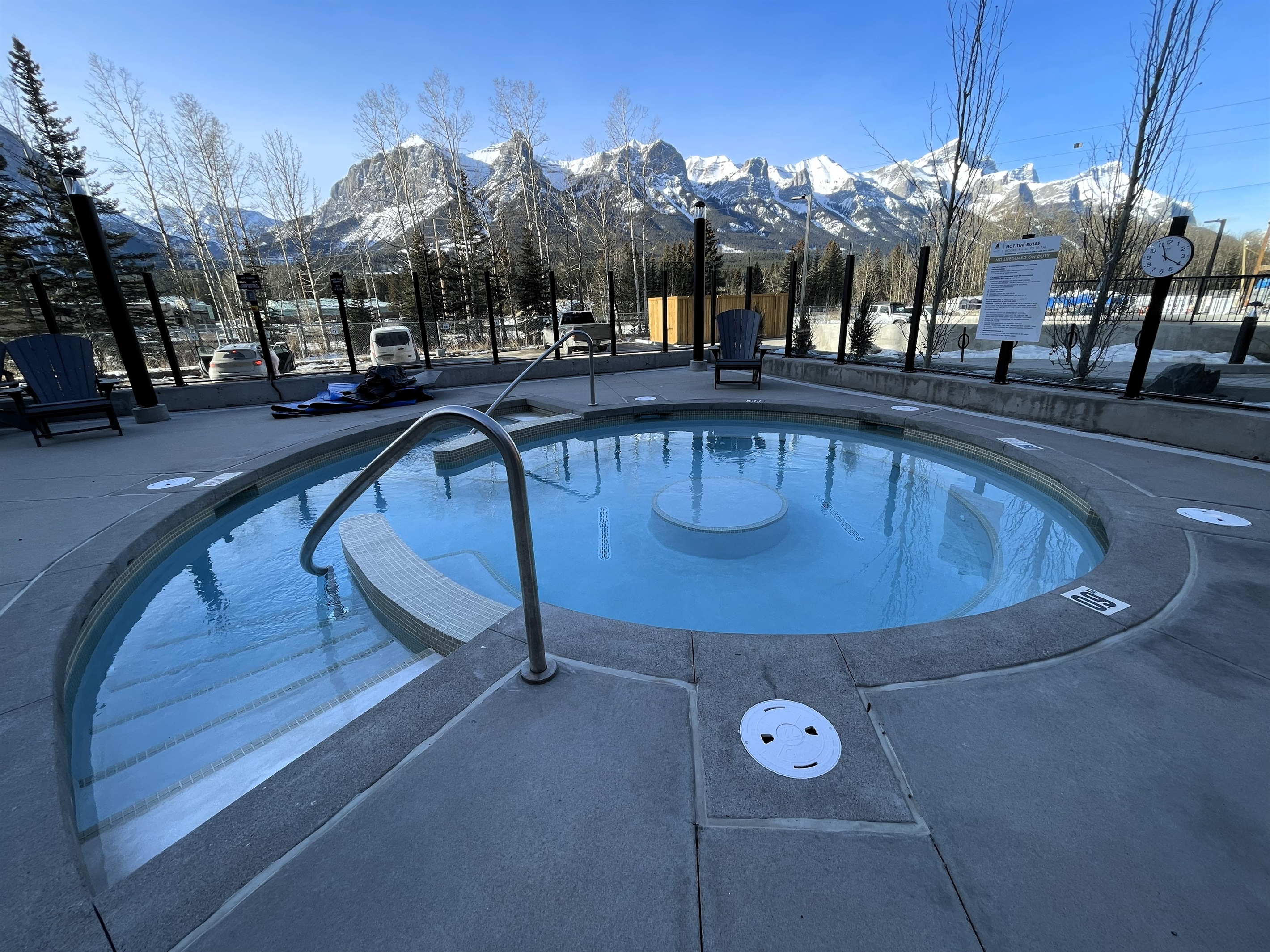 Hot tub with a gentle entry, mountain view, and adjacent pool. Unforgettable mountain view.