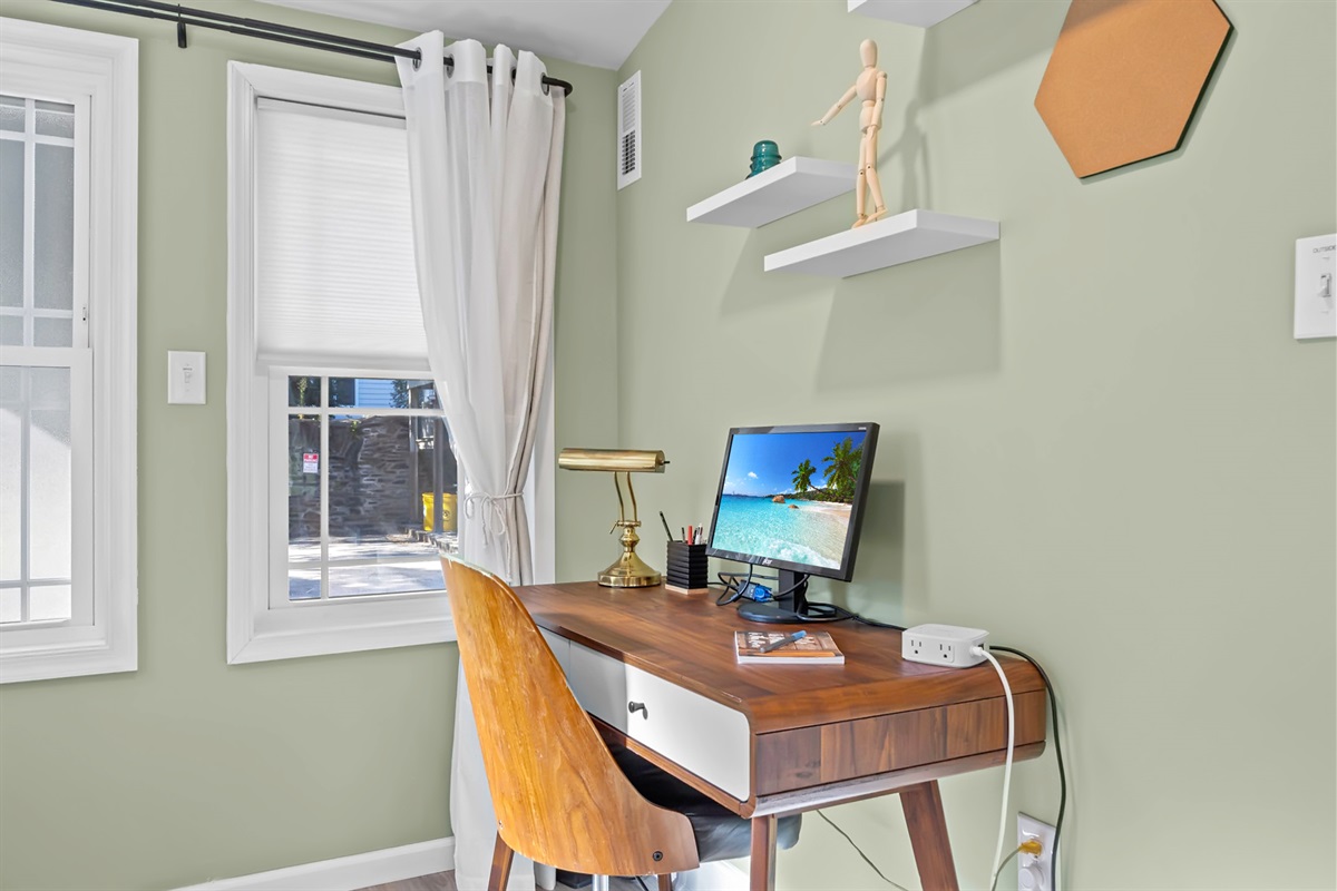 Work in comfort! This dedicated workspace features a desk and a 20-inch monitor for your convenience - perfect for remote work or catching up on emails during your stay