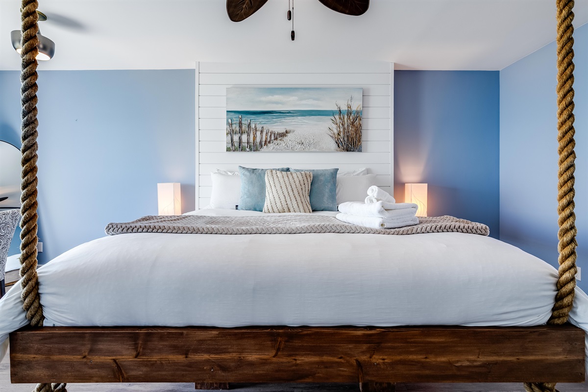 Master Bedroom with King bed and access to second story balcony with calming lake views