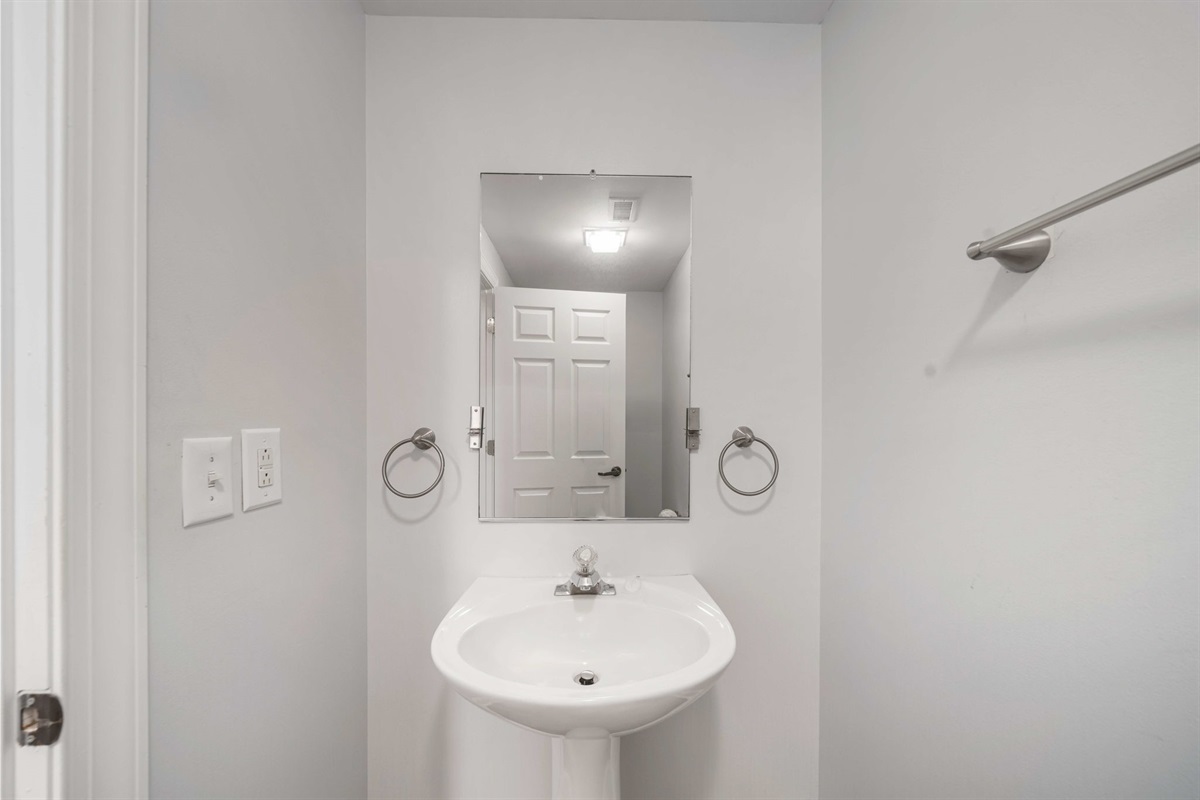 Bathroom 3: hallway half bath | Beach Breeze | Oceanview 202 | 1116 Ocean Blvd, Isle of Palms, SC | IOP Escapes