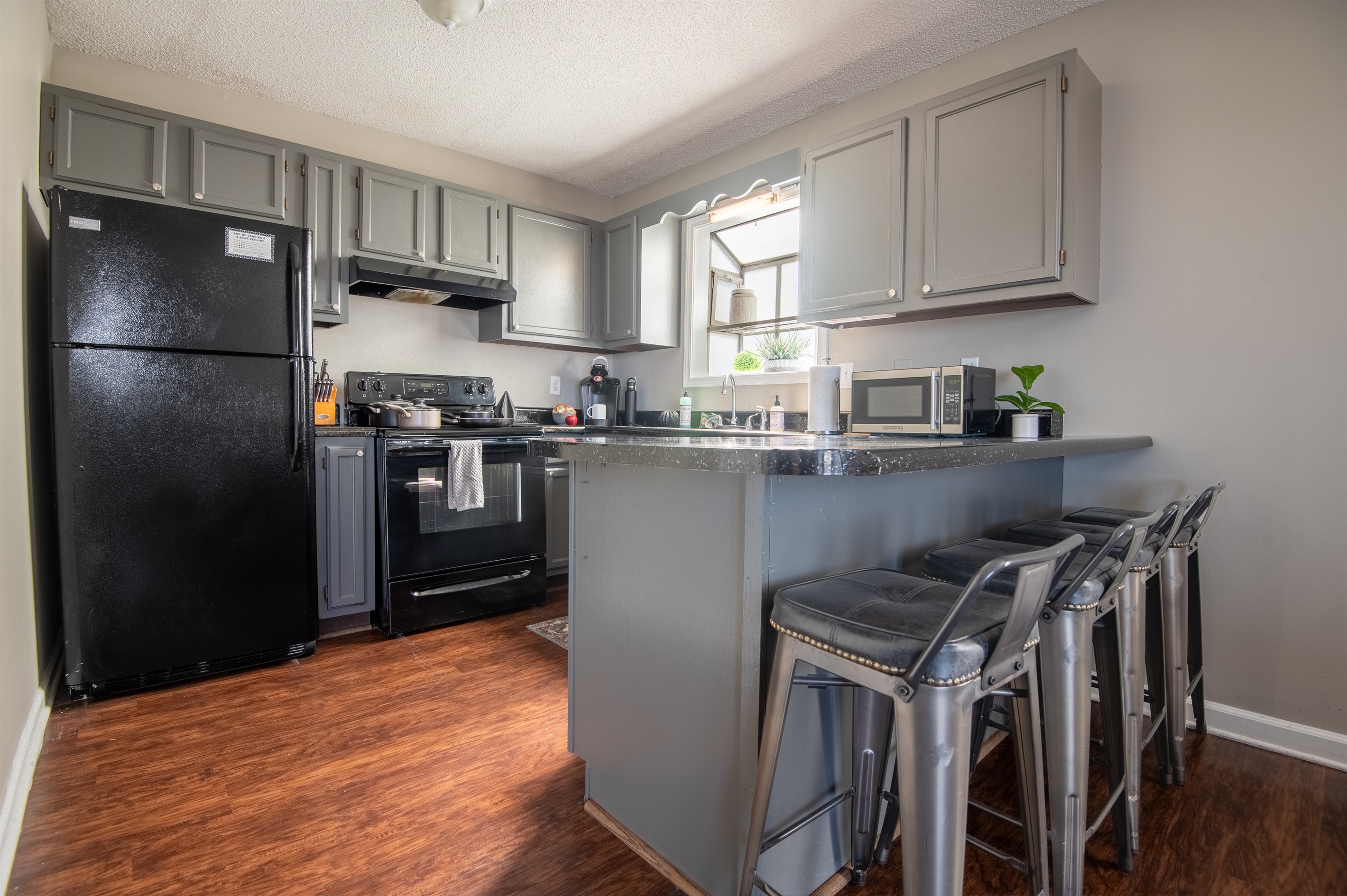 Unit B's full kitchen has plenty of natural lighting to enjoy slow mornings while sipping your coffee or whipping up a chef's breakfast.