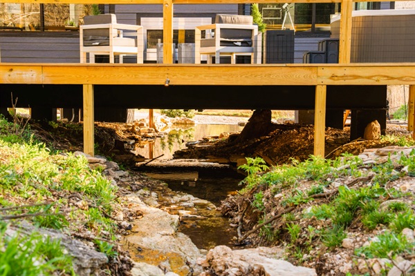 Built directly above the creek—see & hear the water flowing beneath you