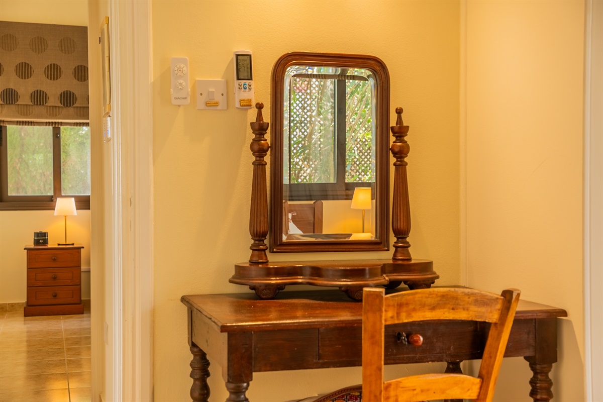 Second king bedroom with direct patio access. King size bed, ceiling fan, dedicated AC/heating unit, vanity, large built-in wardrobes, bluetooth speaker/alarm clock.