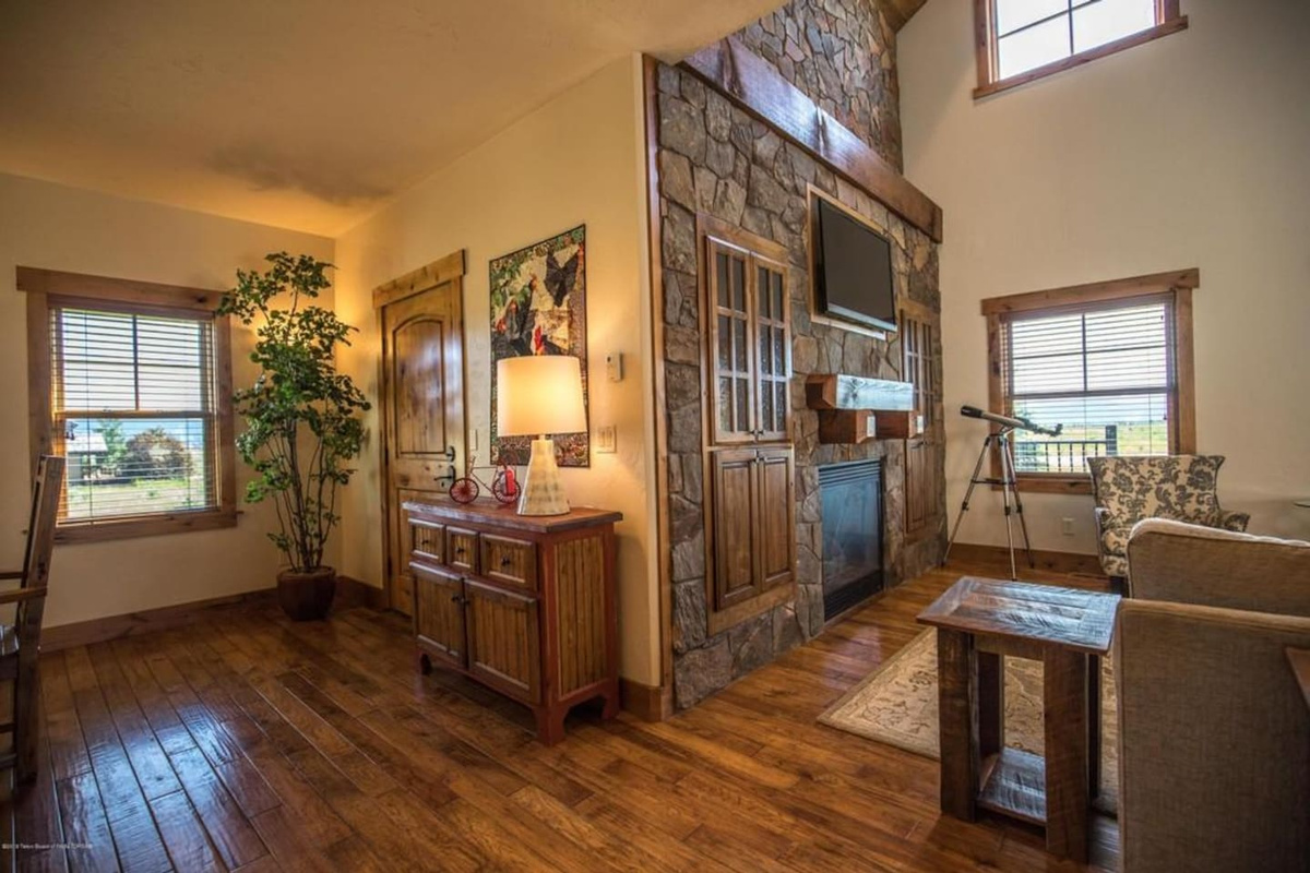 Stone fireplace, plenty of natural light