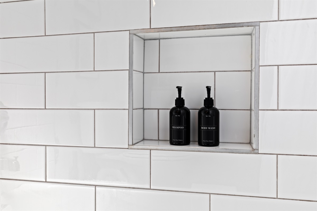 Elegant built-in shelf with premium toiletries for your convenience.