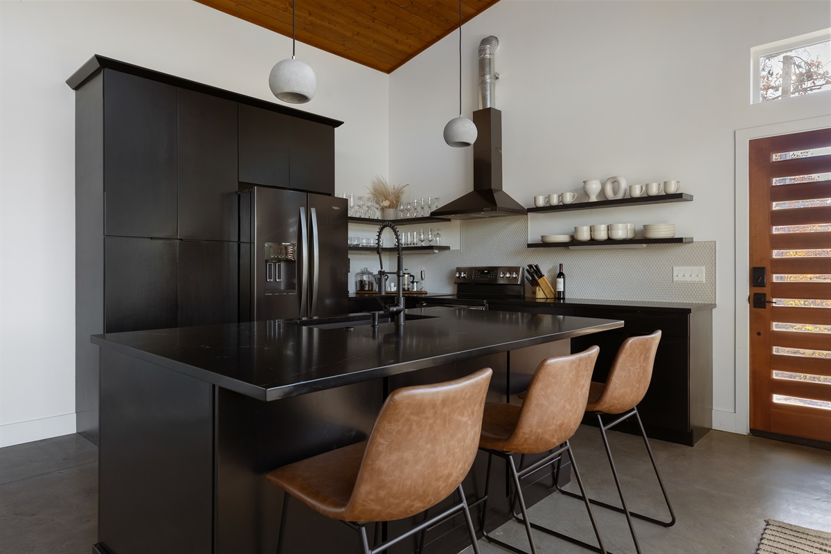 {Kitchen} A bold, beautifully functional space made for slow breakfasts, shared meals, and late-night wine.