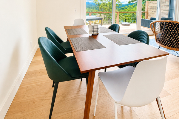 Dinner with a view. Gather around the table and take in the peaceful mountain and lake scenery through the wall of glass just steps away.