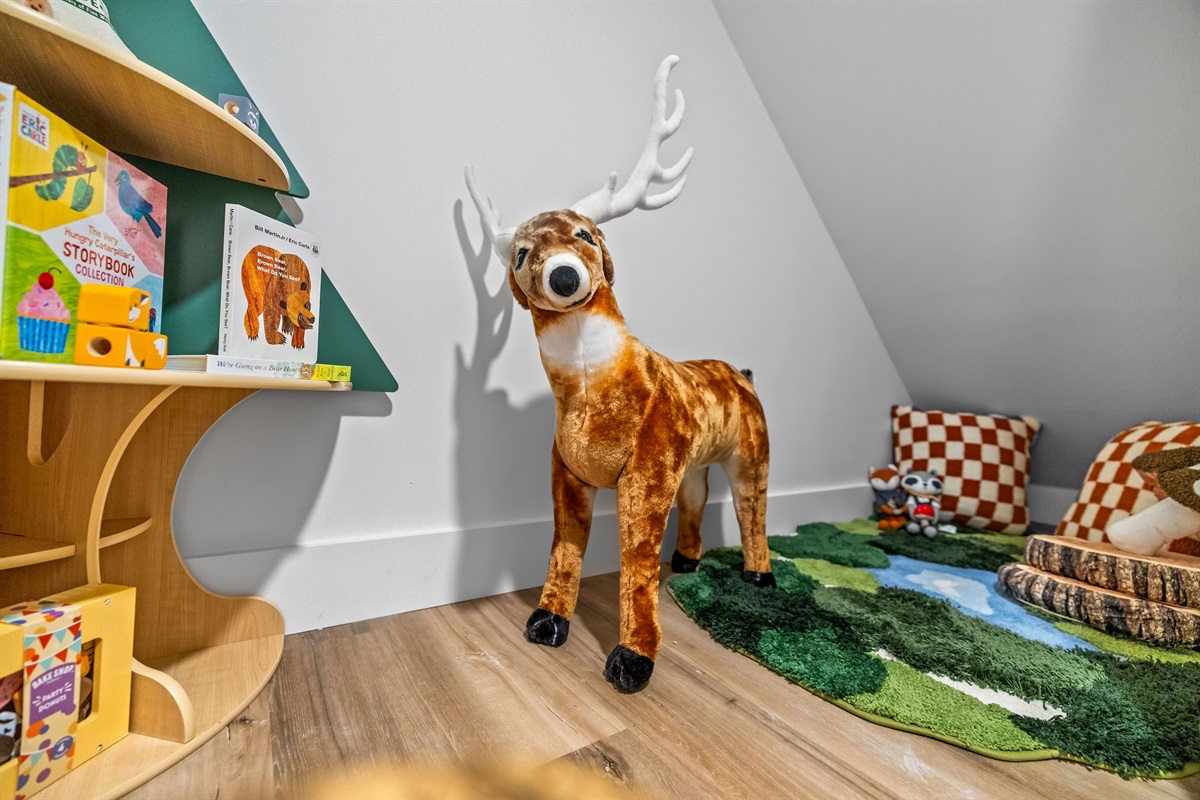 Cozy woodland kids’ nook with books and toys